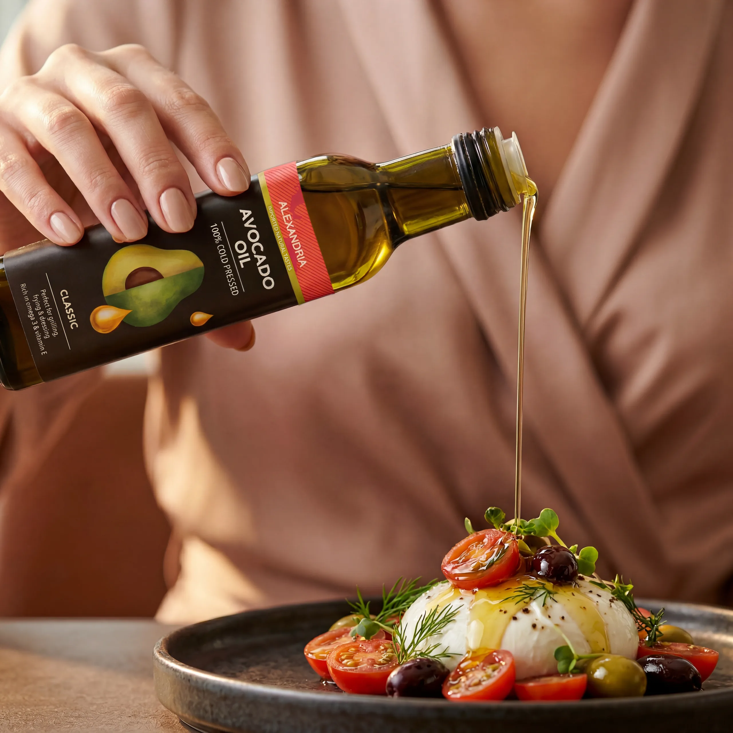 Alexandria avocado oil finishing a burrata salad